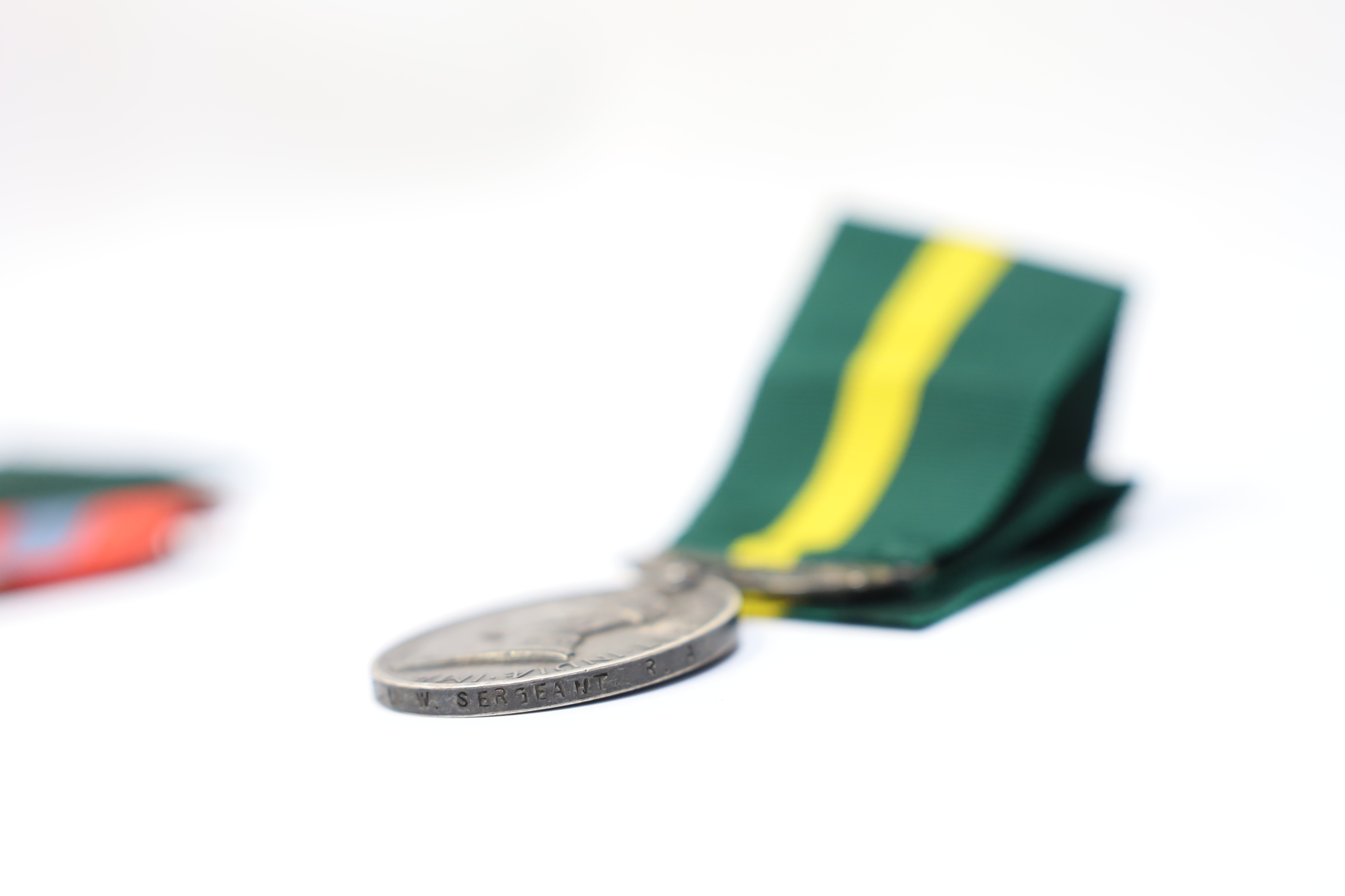 Three assorted service medals; Ed VII Volunteer Officer's Decoration hallmarked for 1905; GV Imperial Service medal to Walter Charles Cornish; GVI Territorial Efficiency medal to 2062789 . S/Sgt. L.W.Sergeant. R.A. Condi
